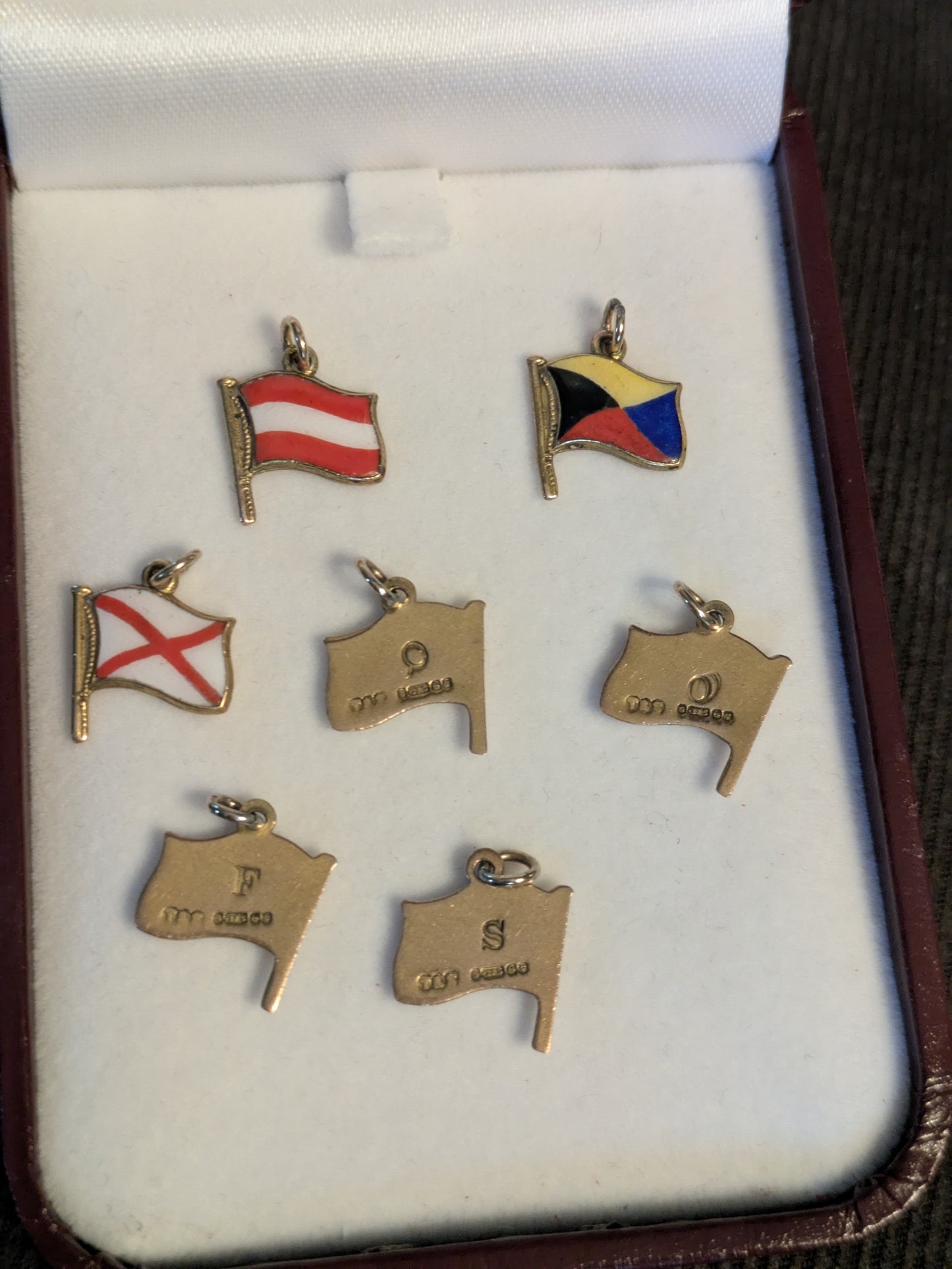 Turner & Simson 9k 9c British Nautical Signal Flag charms 1956 date letter and one Austria flag charm.