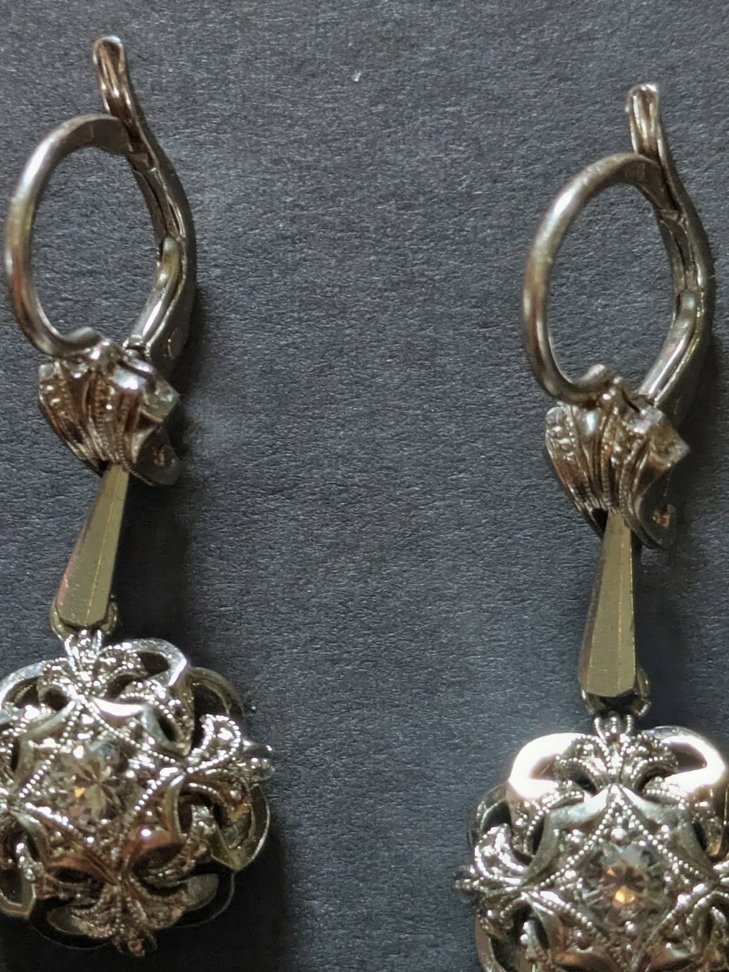 Circa 1950 18k white gold drop dangling earrings with white stones and milgrain detail