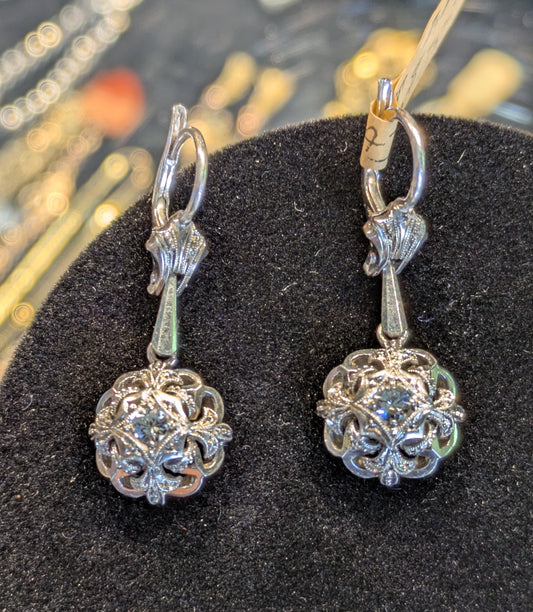 Circa 1950 18k white gold drop dangling earrings with white stones and milgrain detail
