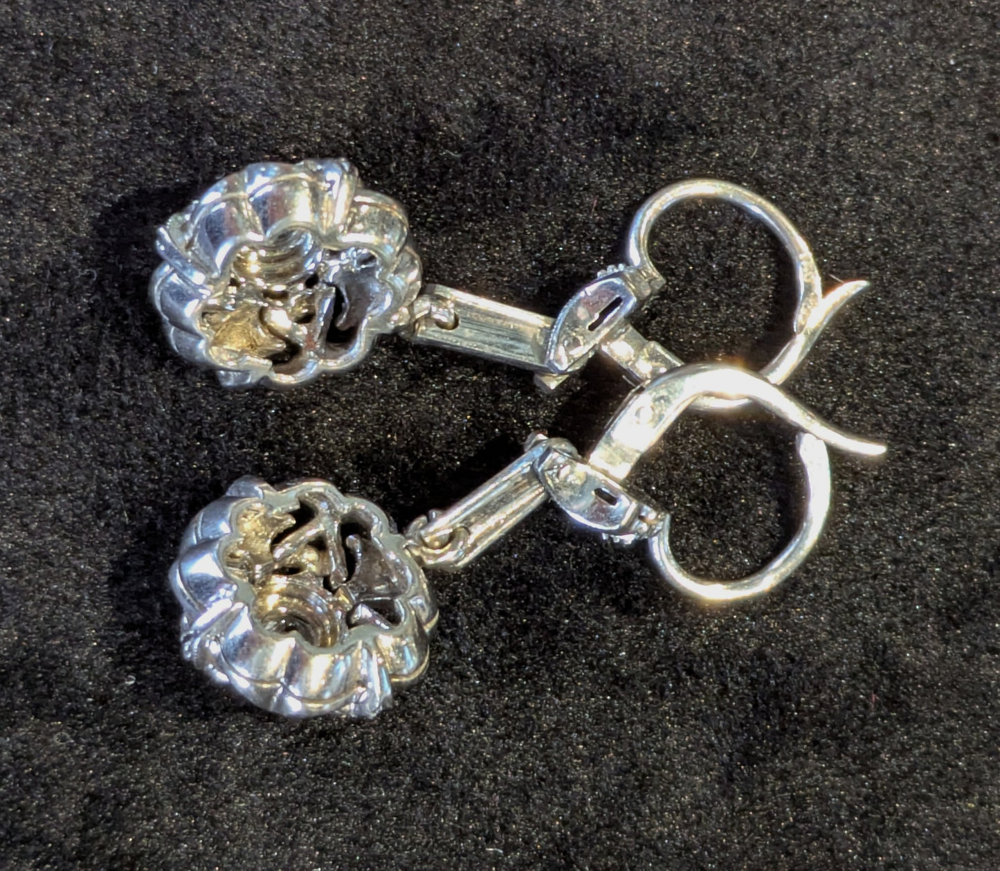 Circa 1950 18k white gold drop dangling earrings with white stones and milgrain detail