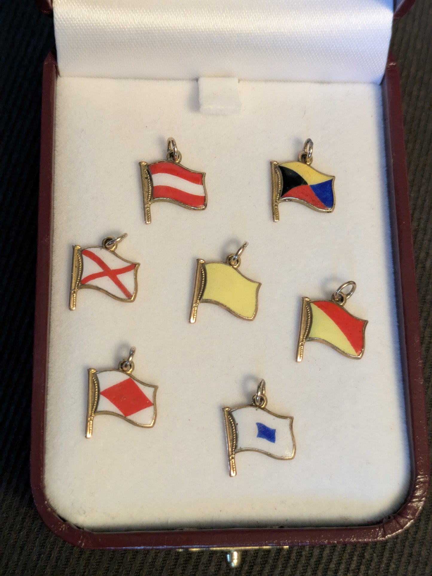 Turner & Simson 9k 9c British Nautical Signal Flag charms 1956 date letter and one Austria flag charm.